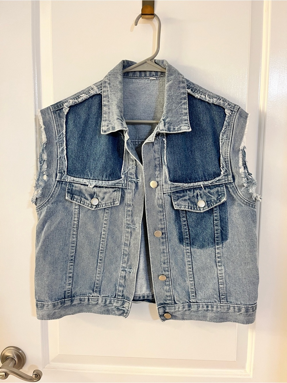 Vintage two-tone blue denim vest with distressed details